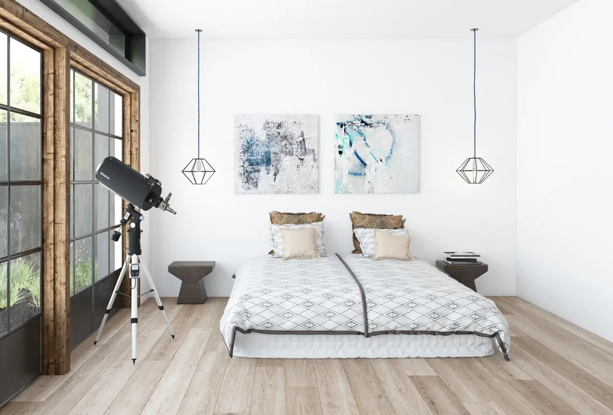 Modern bedroom interior with a telescope in front of a large win