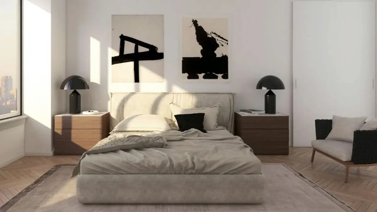 Minimalistyczna sypialnia z szarym łóżkiem i dwiema japońskimi grafikami