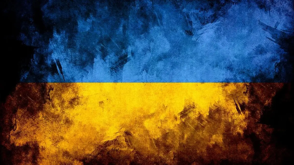 Flaga Ukrainy ogarniana przez cienie