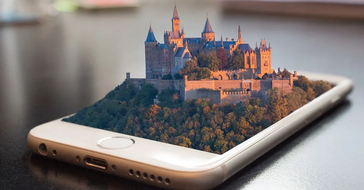 zamek wyrastający z ekranu smartfona