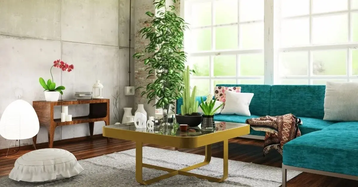 Salon z turkusową sofą i złotym stolikiem kawowym