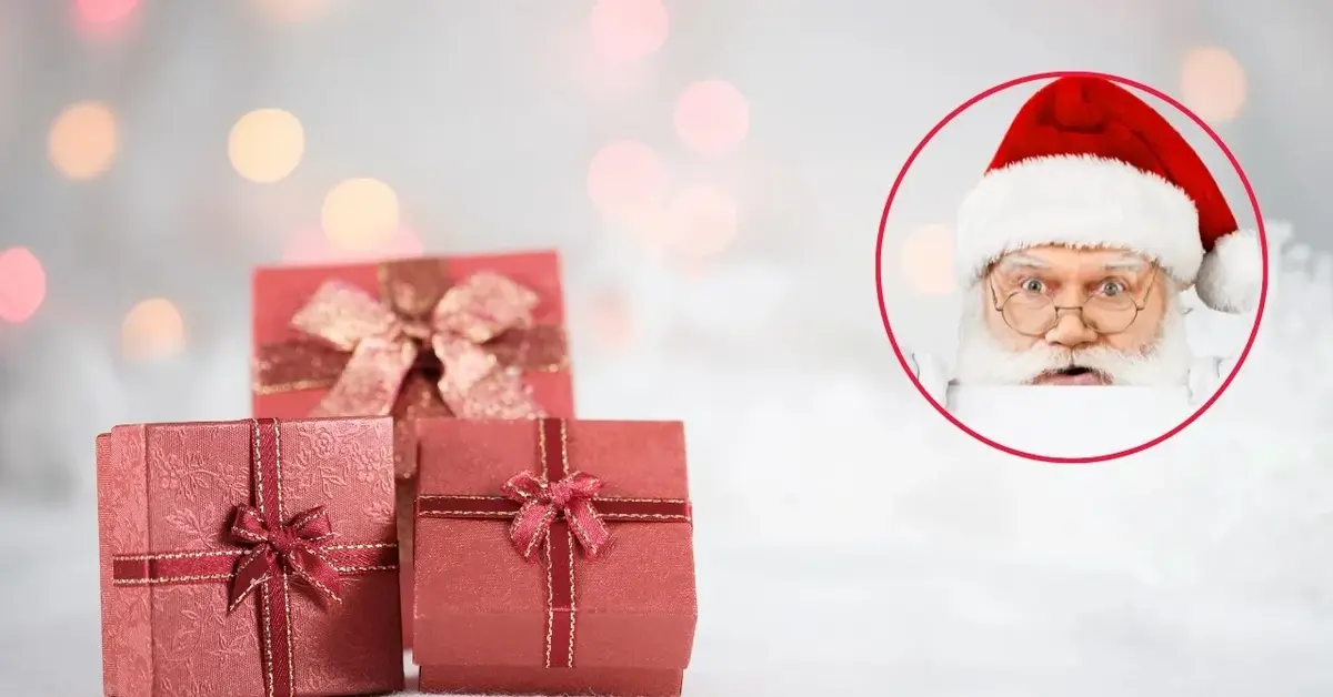Zdziwiony Święty Mikołaj w czerwonym kółku a obok prezenty.