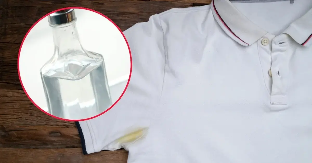 Koszulka z żółtymi plamami i ocet w specjalnej butelce.